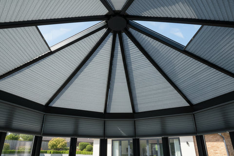 Blue Mirage Honeycomb Cellular blind with a translucent design, showing stripe texture and colour close up. Cellular Blind with light filtering and energy efficient properties for shaped roof blinds.
